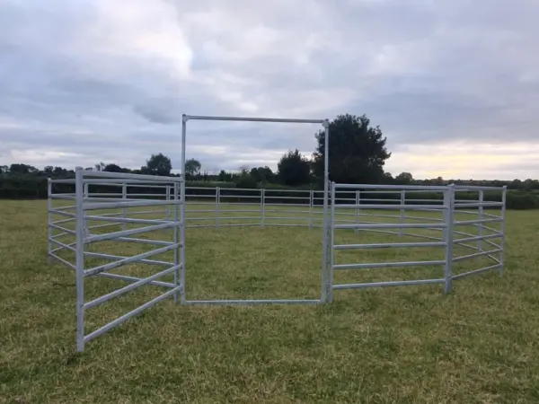 Horse lunging ring in field - adjustable height gate open - round ring